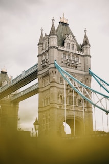 a tall bridge with a sky in the background