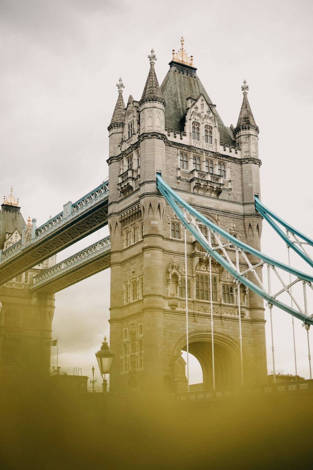 a tall bridge with a sky in the background