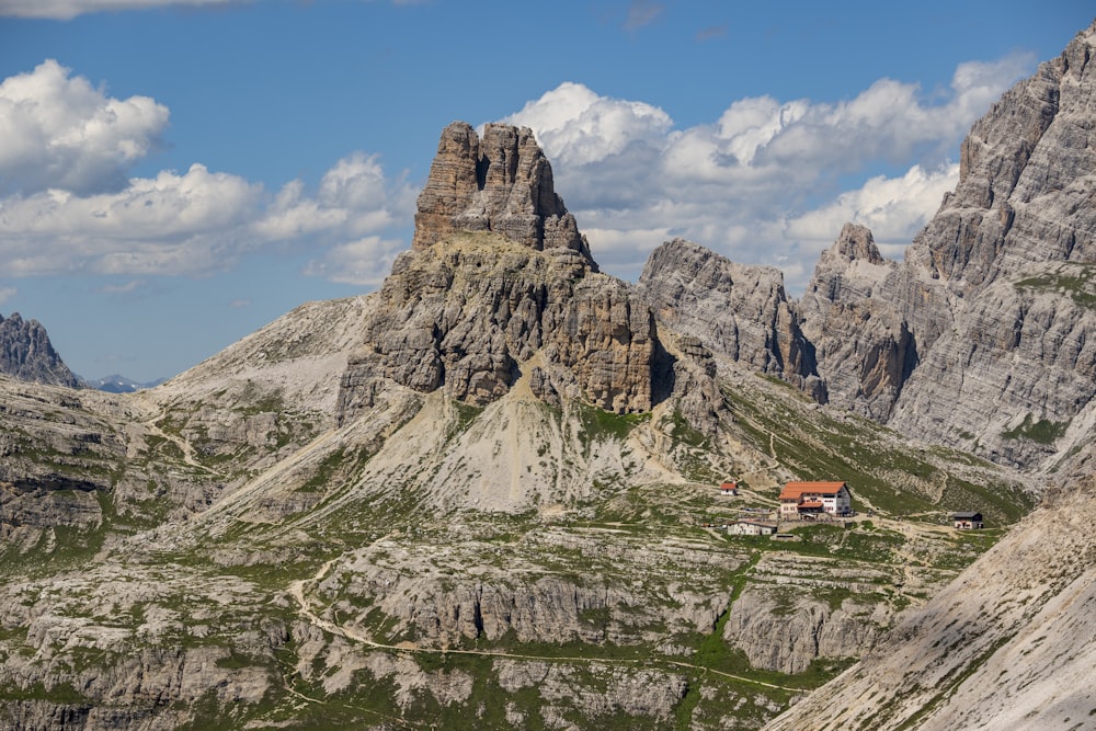 a house in the middle of a mountain range