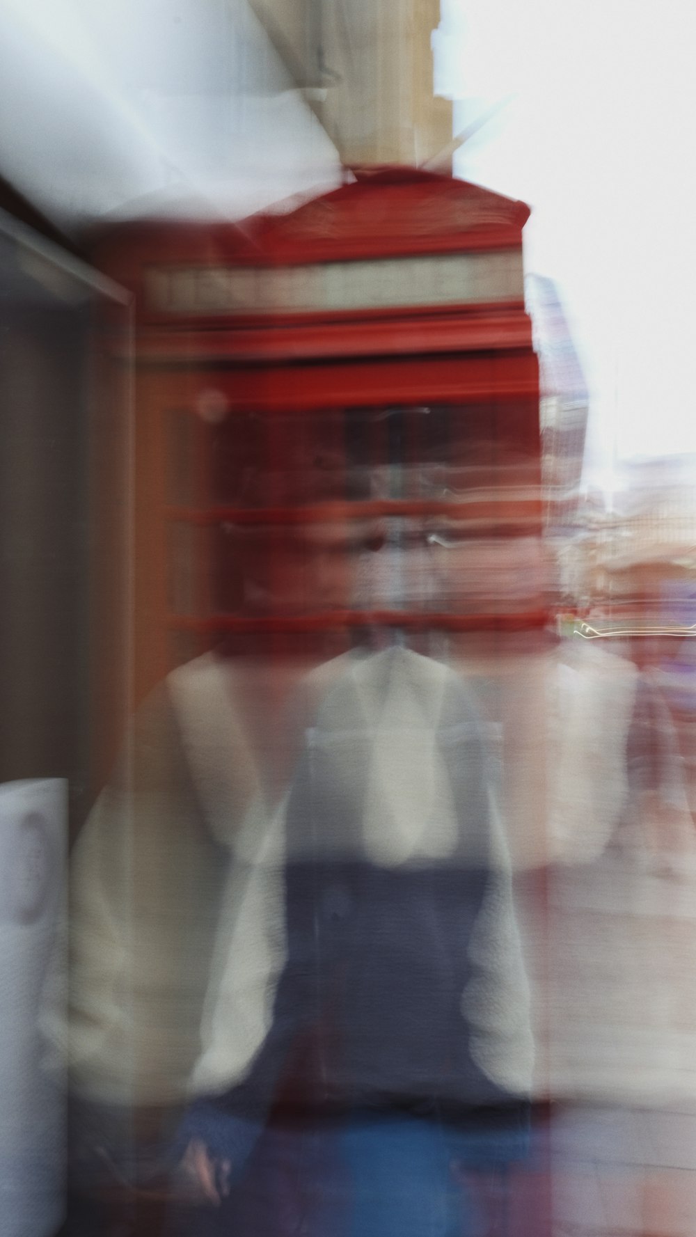 a blurry photo of a person sitting at a table