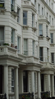 a large white building with many windows and balconies