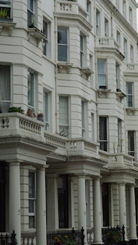 a large white building with many windows and balconies