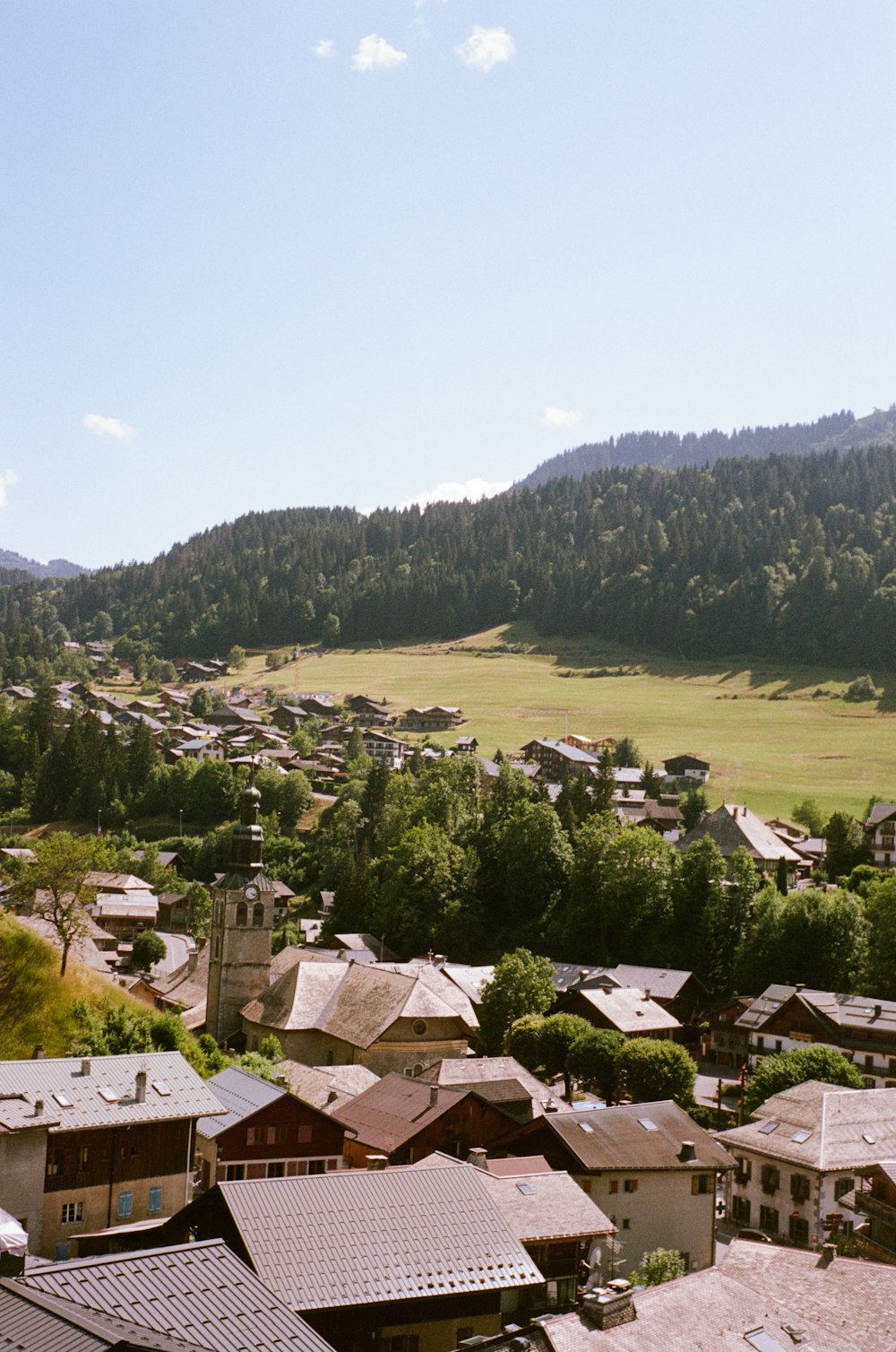 a view of a town with a mountain in the background