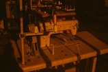 a sewing machine sitting on top of a wooden table