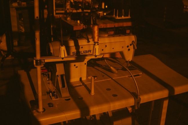 a sewing machine sitting on top of a wooden table