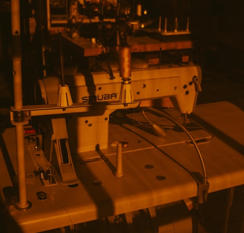 a sewing machine sitting on top of a wooden table