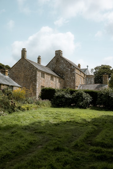 Stone country house with hedged lawned garden near Skipton