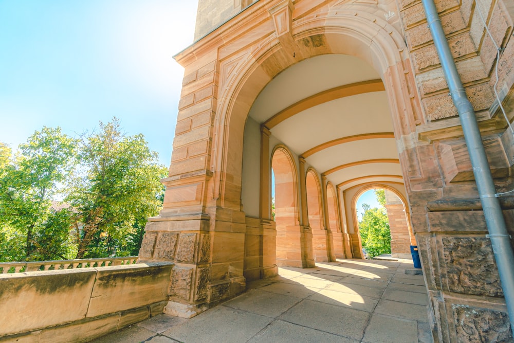 a large arch with a clock on the side of it