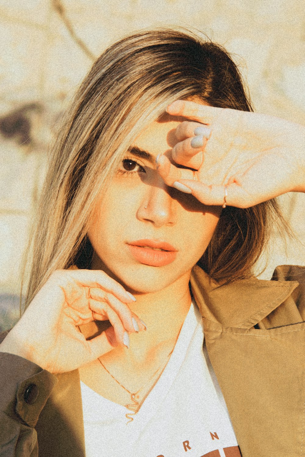 a woman with long hair is posing for a picture