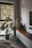 Cozy living room corner with lush indoor plants and natural light
