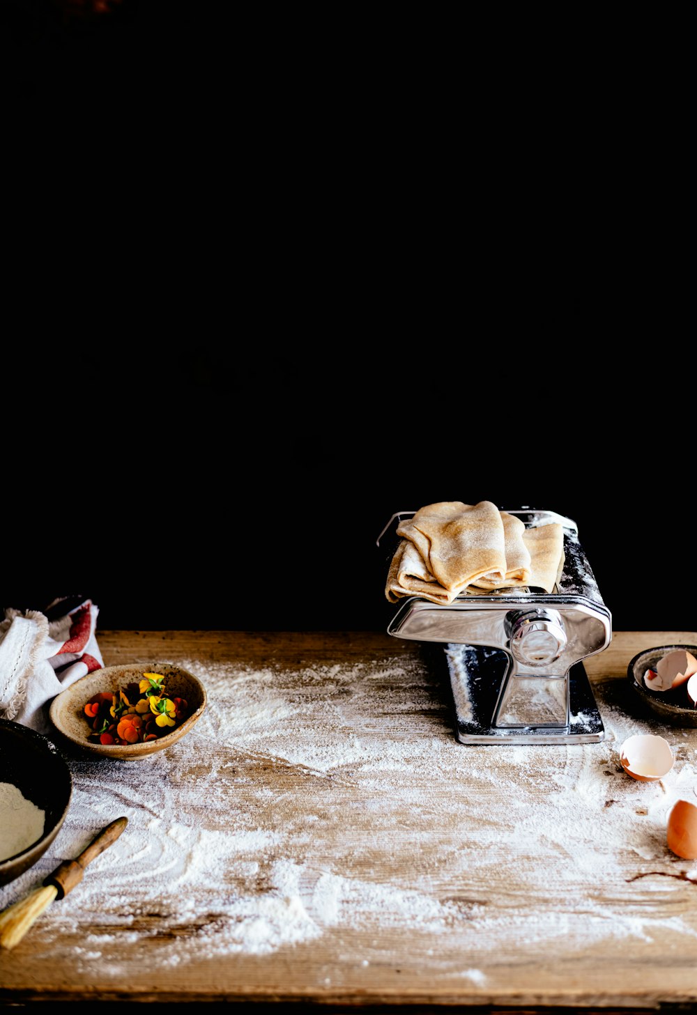 a wooden table topped with lots of food