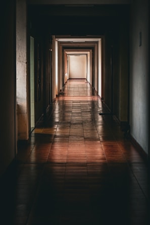 a long hallway with tiled floors and walls