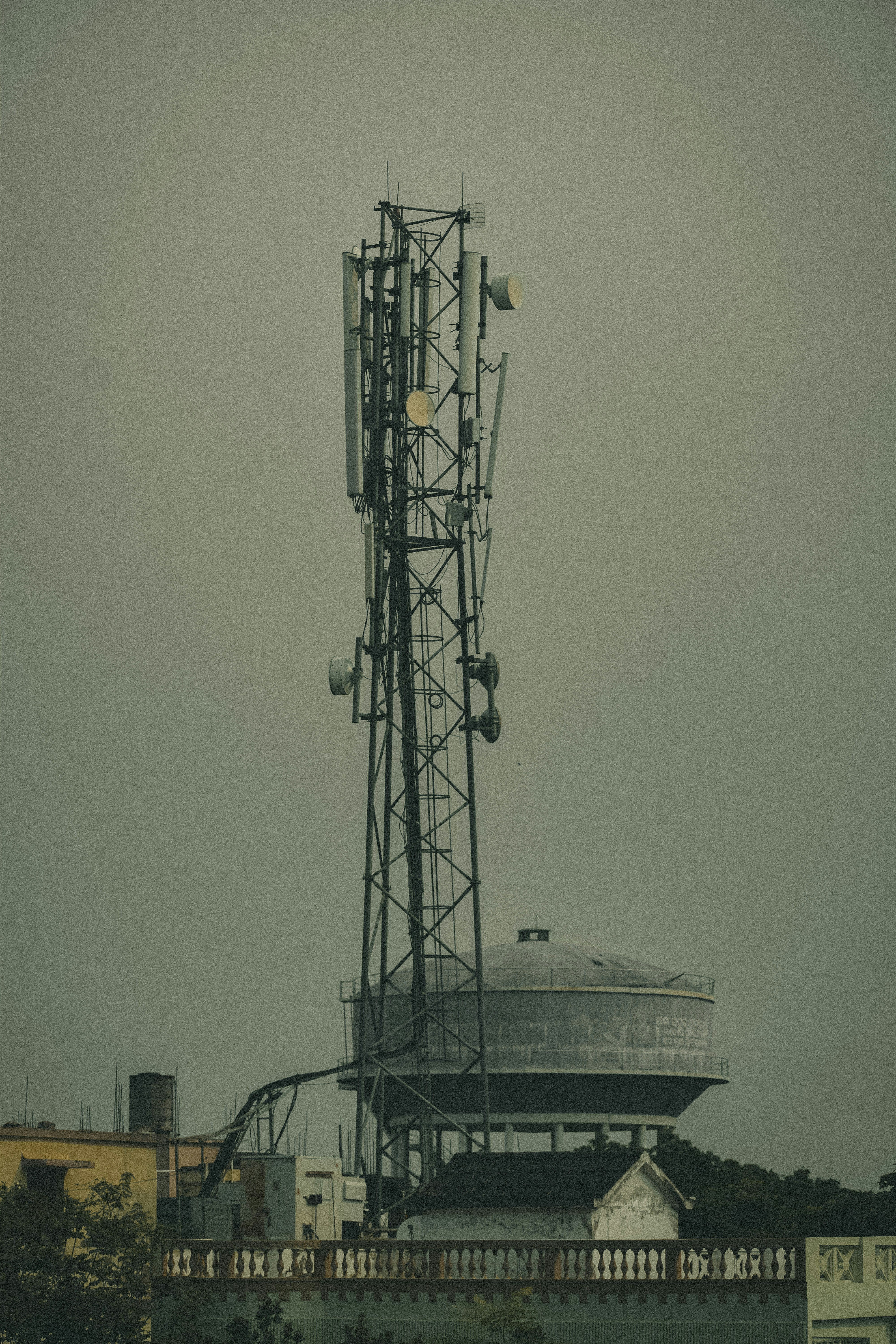 a tall tower with lots of antennas on top of it