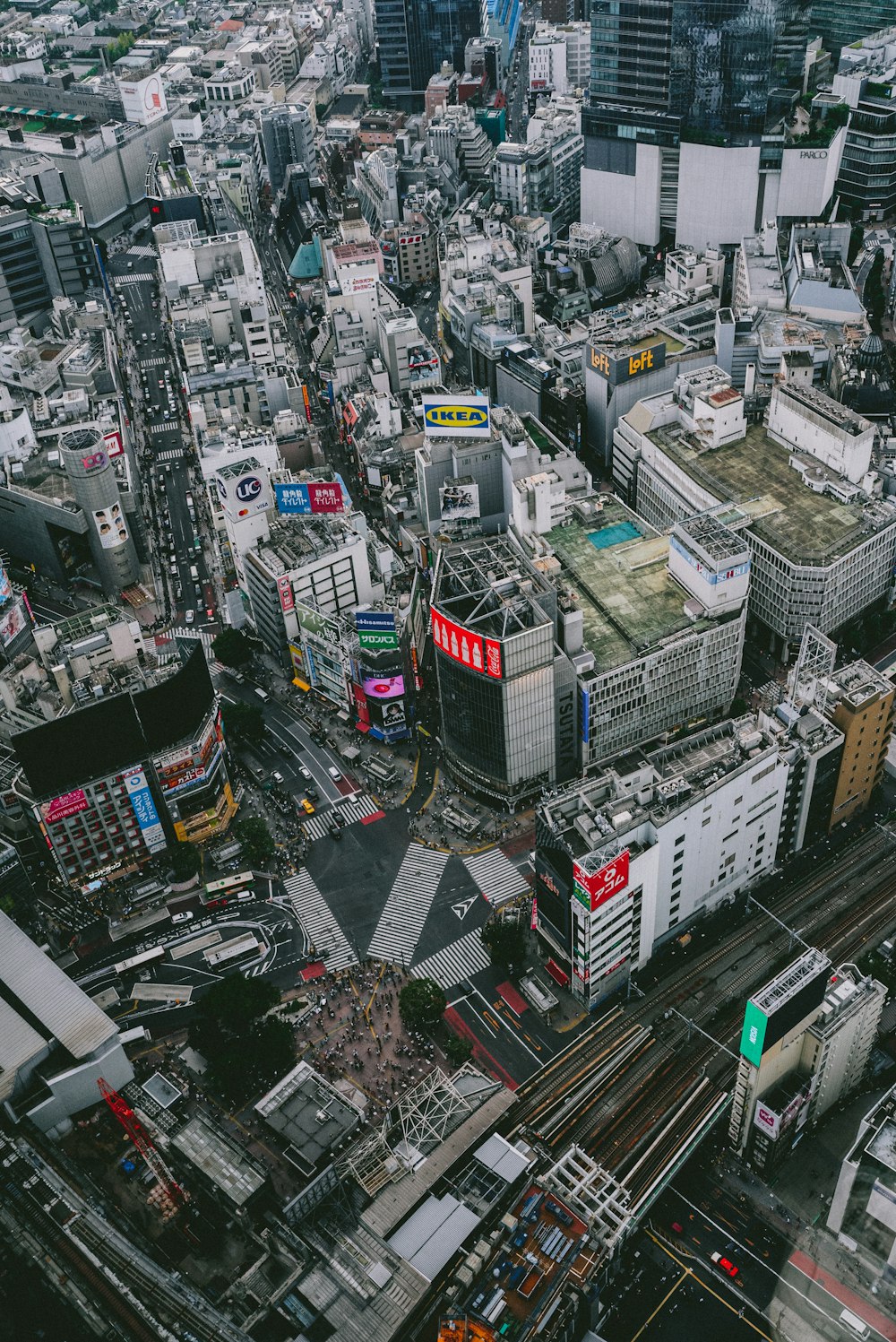 an aerial view of a city with lots of tall buildings