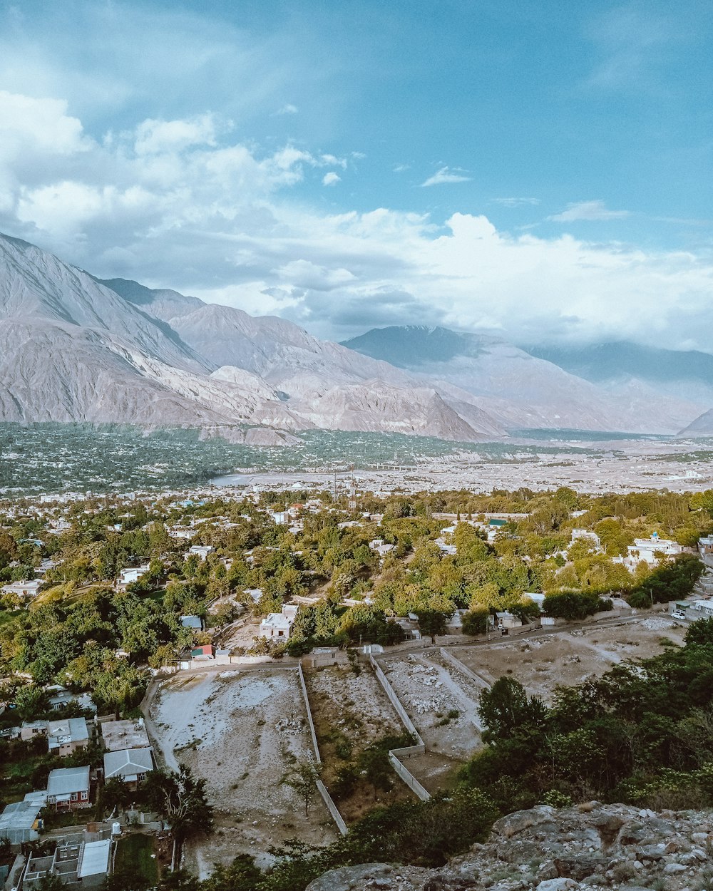 an aerial view of a small town in the mountains