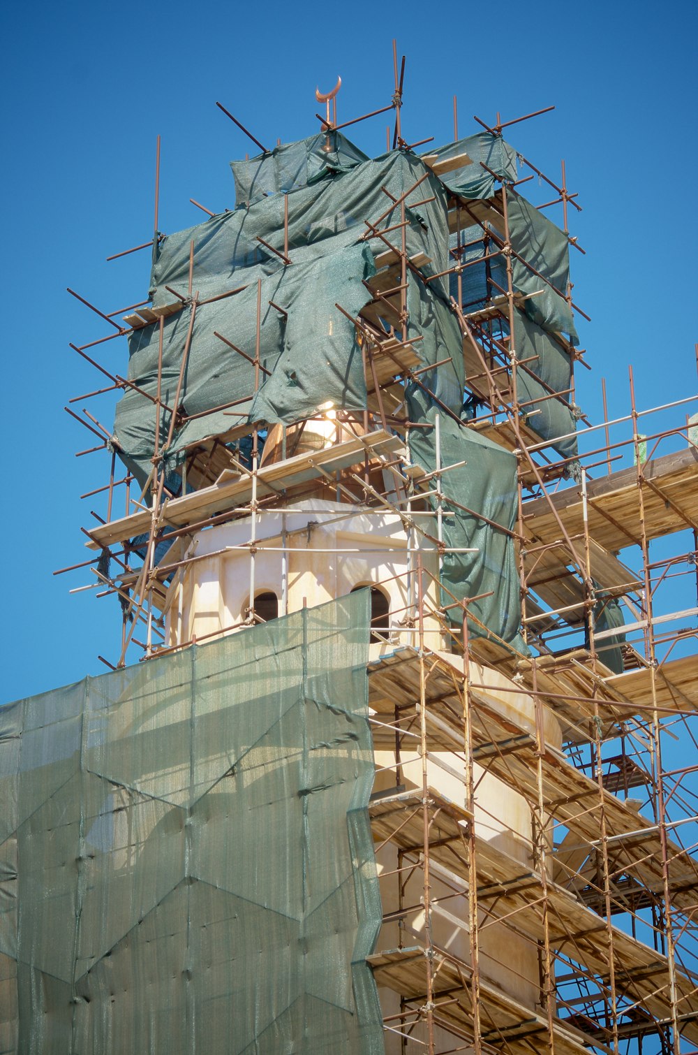 a large clock tower with scaffolding around it