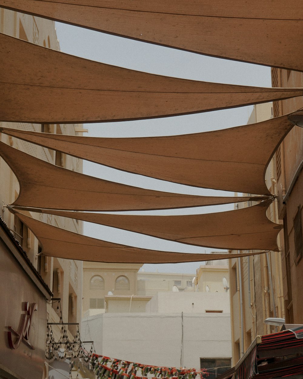 a street with a bunch of clothes hanging on a line