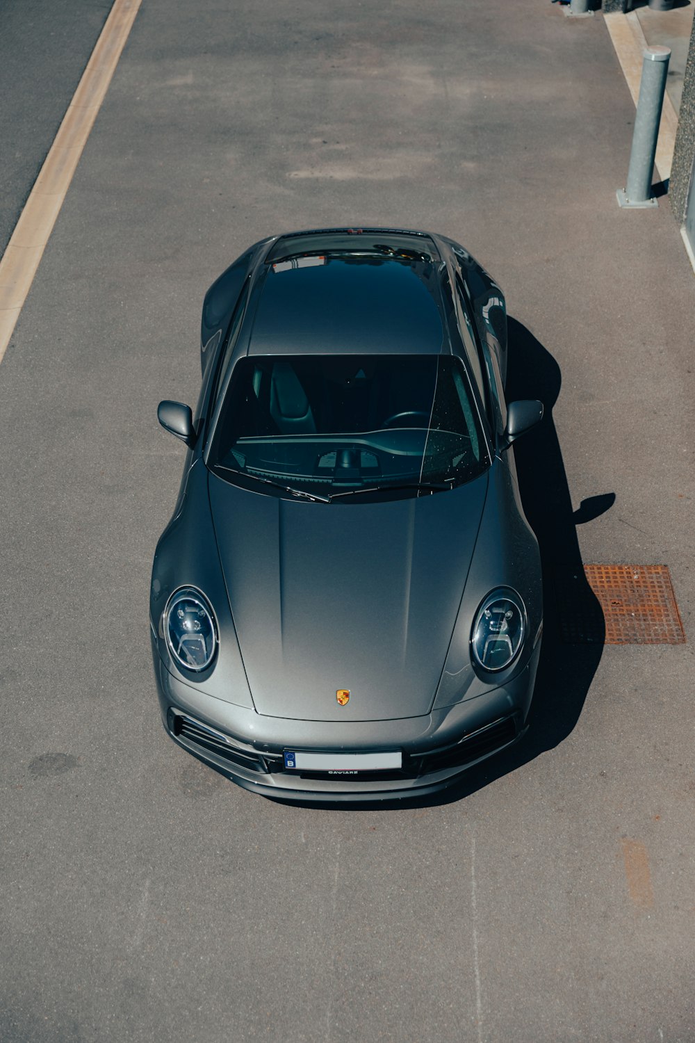 a silver sports car parked in a parking lot