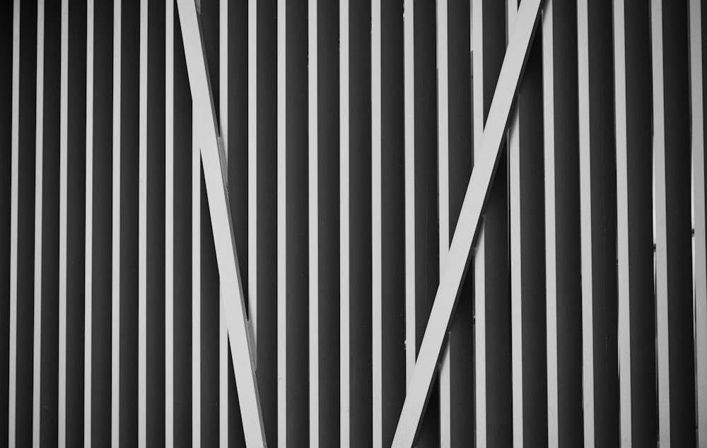 a black and white photo of a metal wall