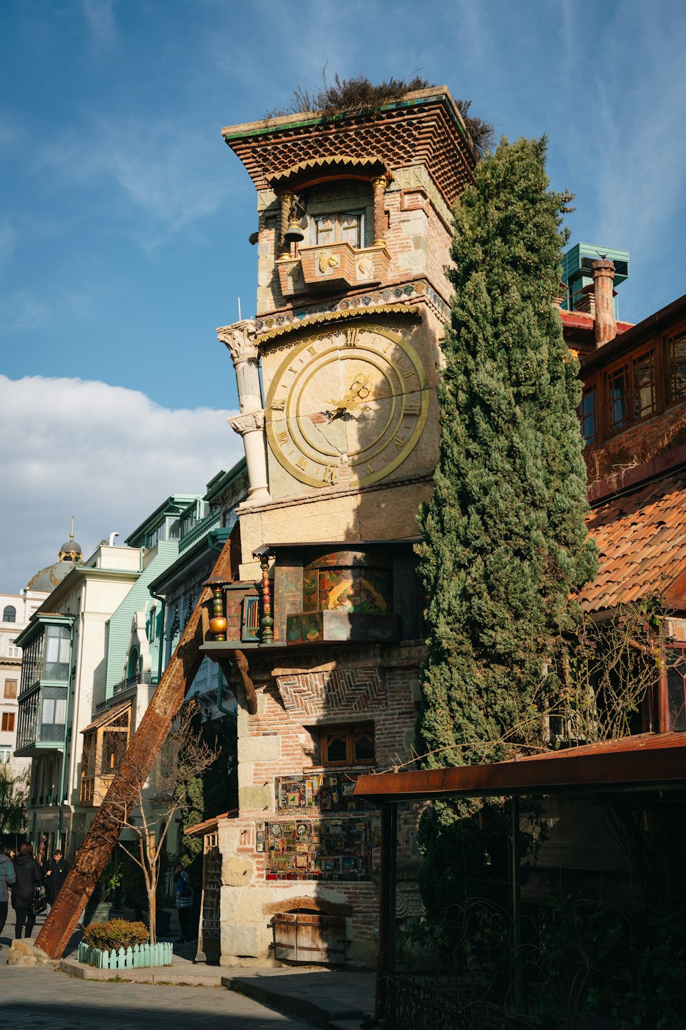 a tall tower with a clock on the side of it