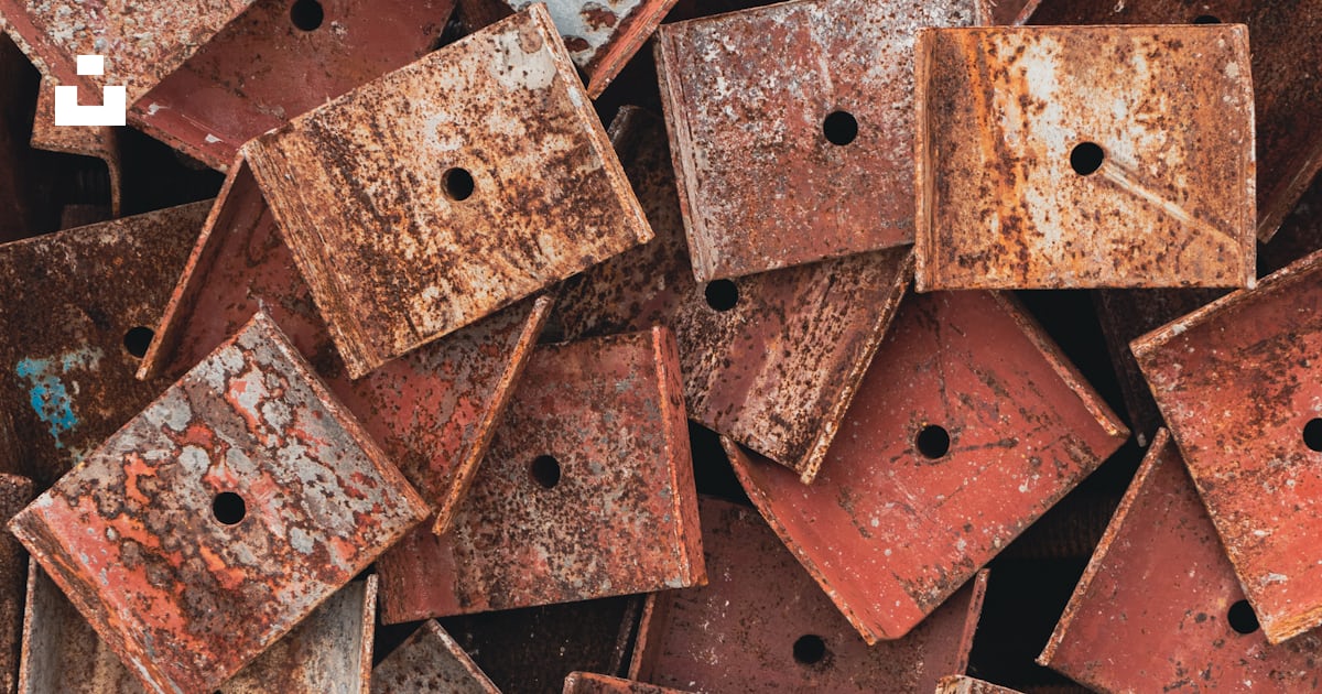 A pile of rusted metal boxes with holes in them photo – Free Rust Image ...