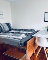 A modern platform bed with a minimalist aesthetic.