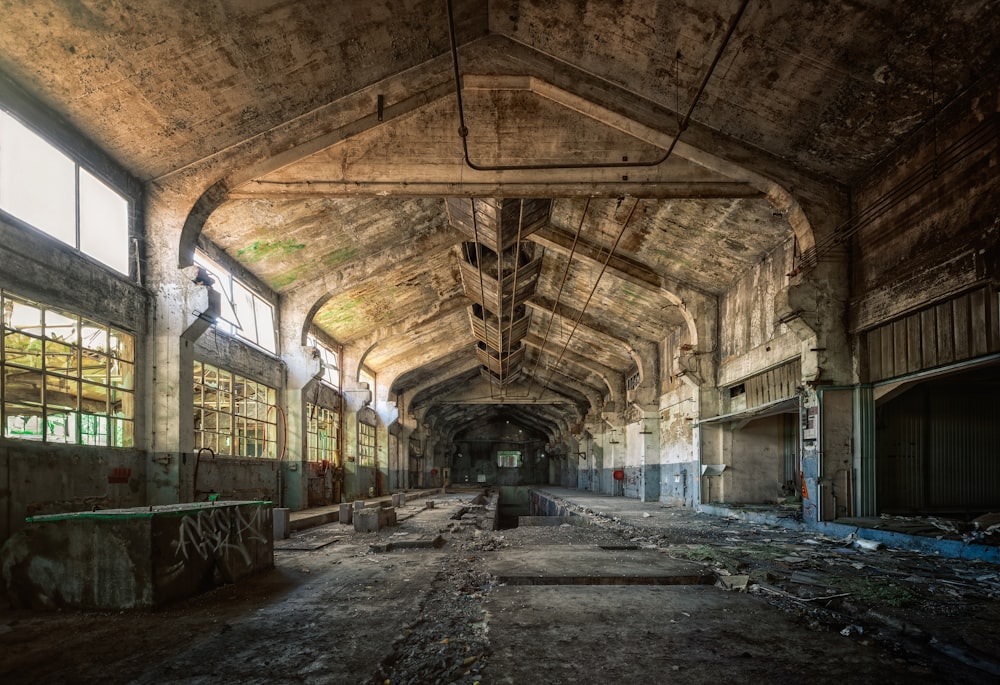 an abandoned train station with lots of windows