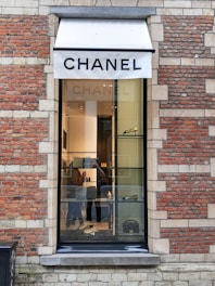 A chic corner inside Bergdorf Goodman showcasing Chanel handbags and accessories.
