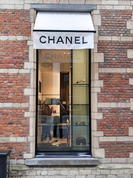 A chic corner inside Bergdorf Goodman showcasing Chanel handbags and accessories.
