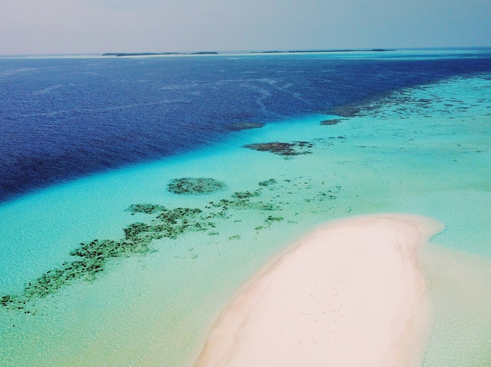 an aerial view of a beach and water