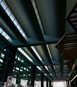 Commercial showroom featuring sleek steel structural elements and glass walls.