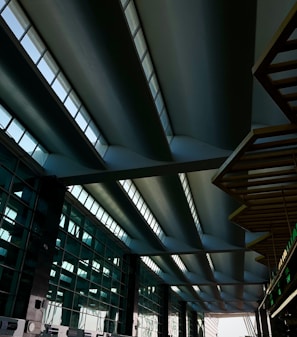 Commercial showroom featuring sleek steel structural elements and glass walls.