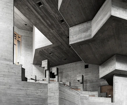 Brutalist commercial interior under construction with concrete walls and geometric lines.