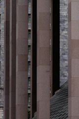 Modular precast concrete columns aligned precisely on a construction site.