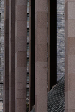Modular precast concrete columns aligned precisely on a construction site.