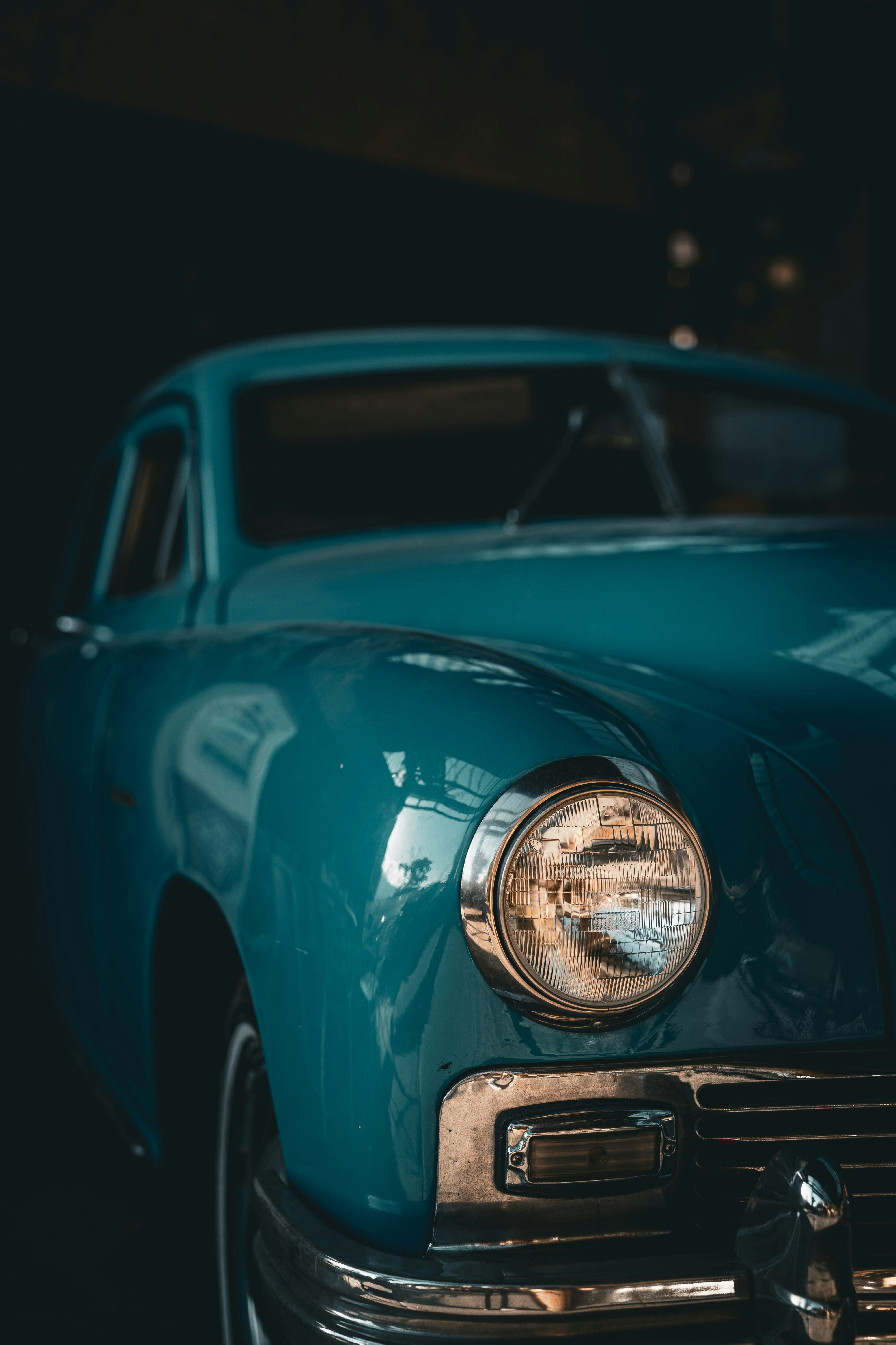 a close up of the front of a blue car