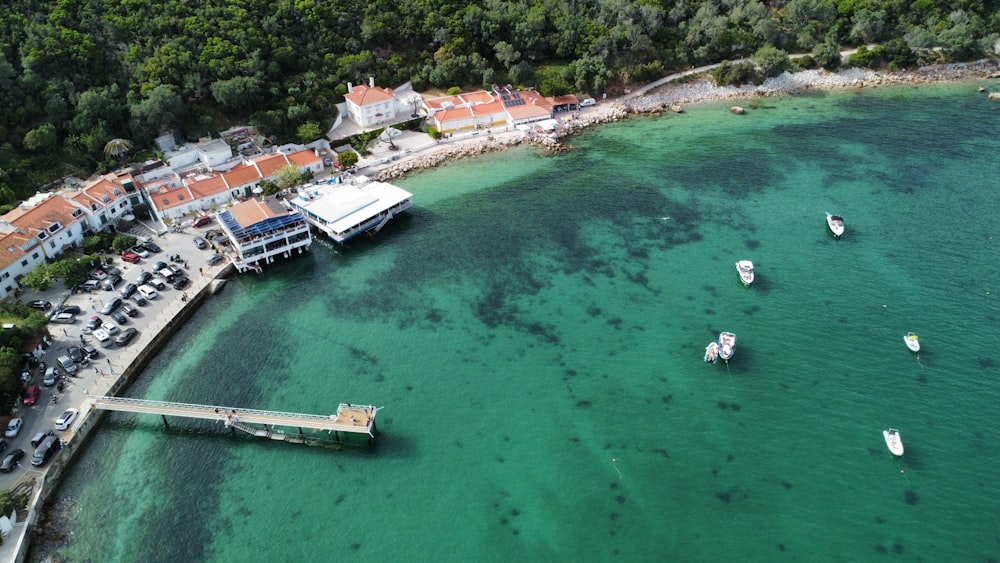 an aerial view of a marina with boats in the water