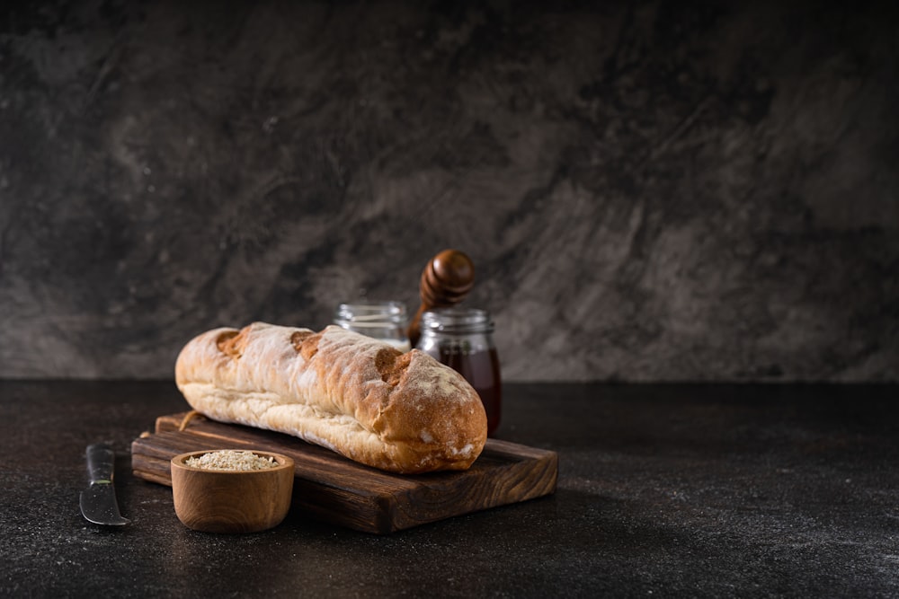 a loaf of bread sitting on top of a cutting board