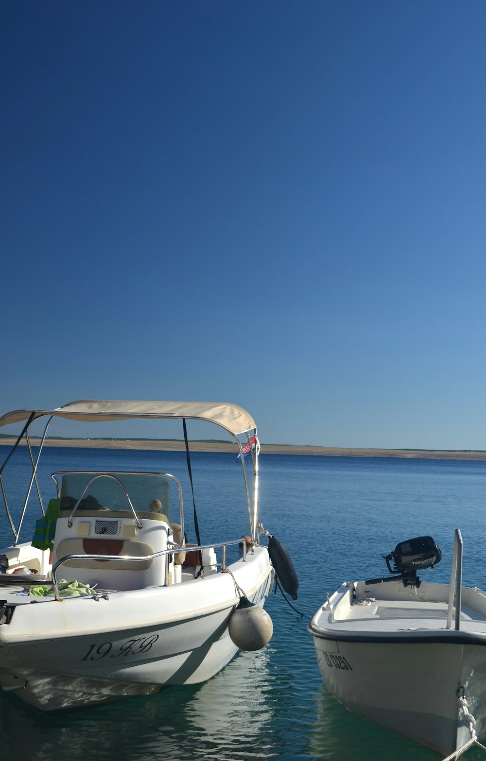 a couple of boats that are sitting in the water