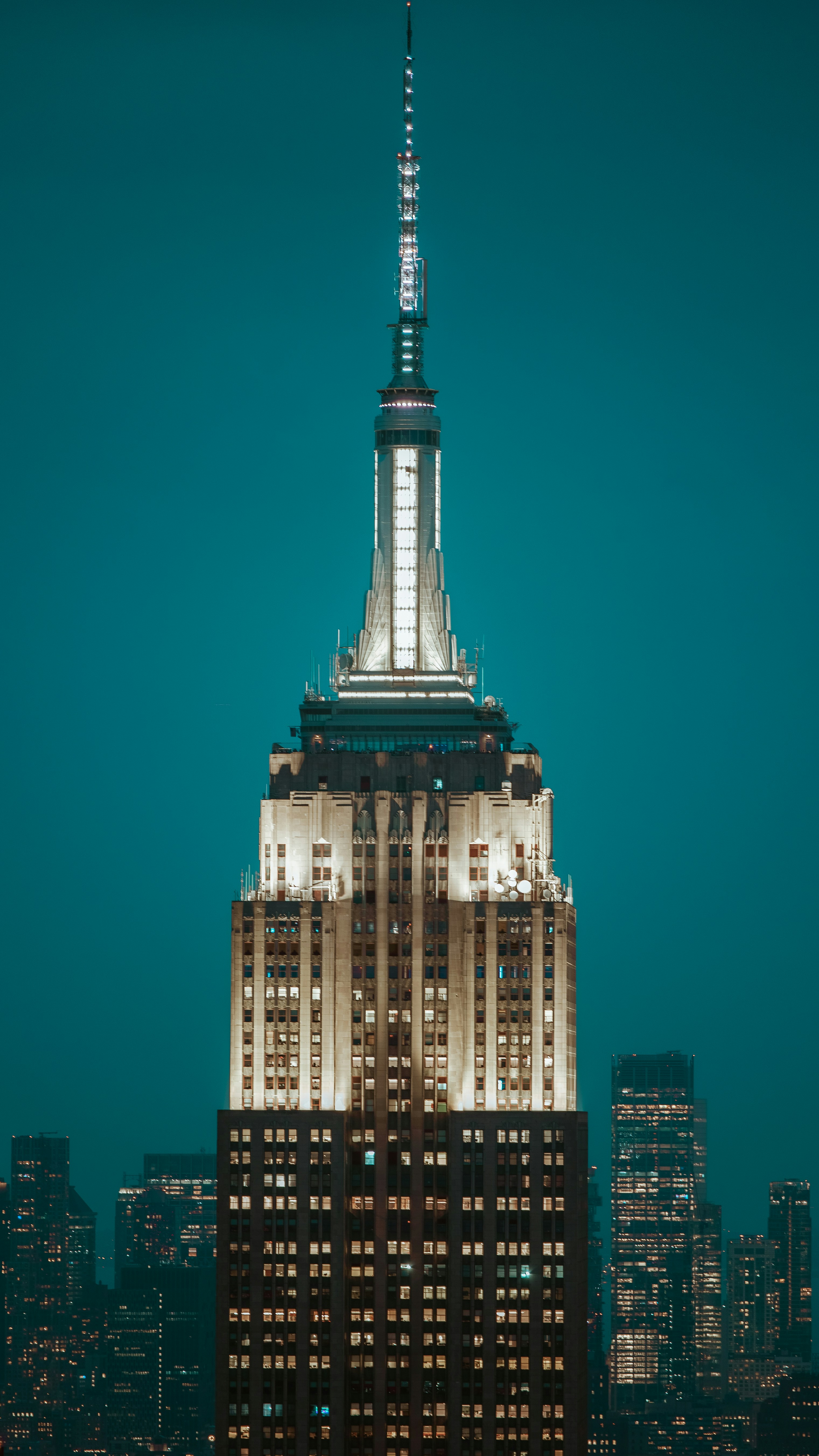 the top of a building lit up at night