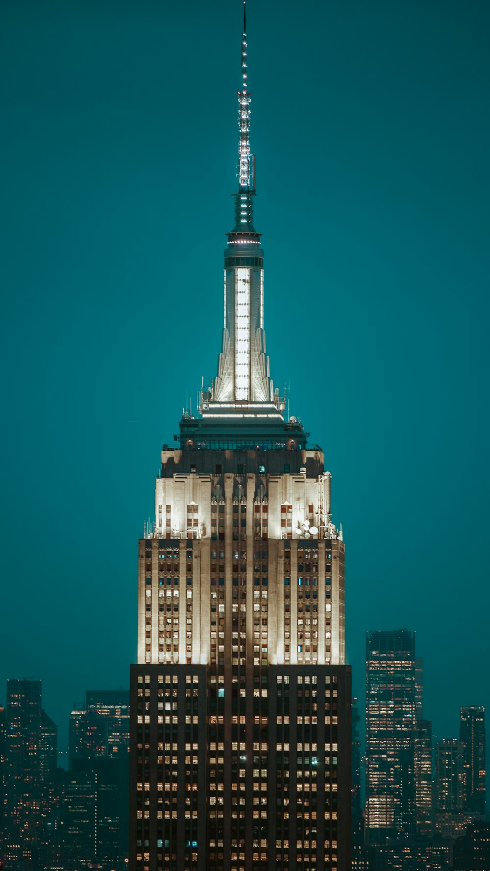 the top of a building lit up at night