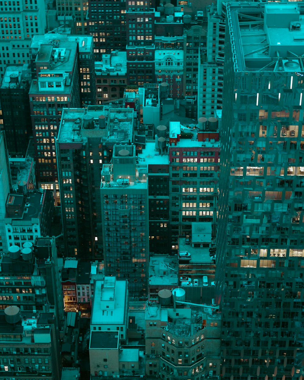 a view of a city at night from the top of a tall building