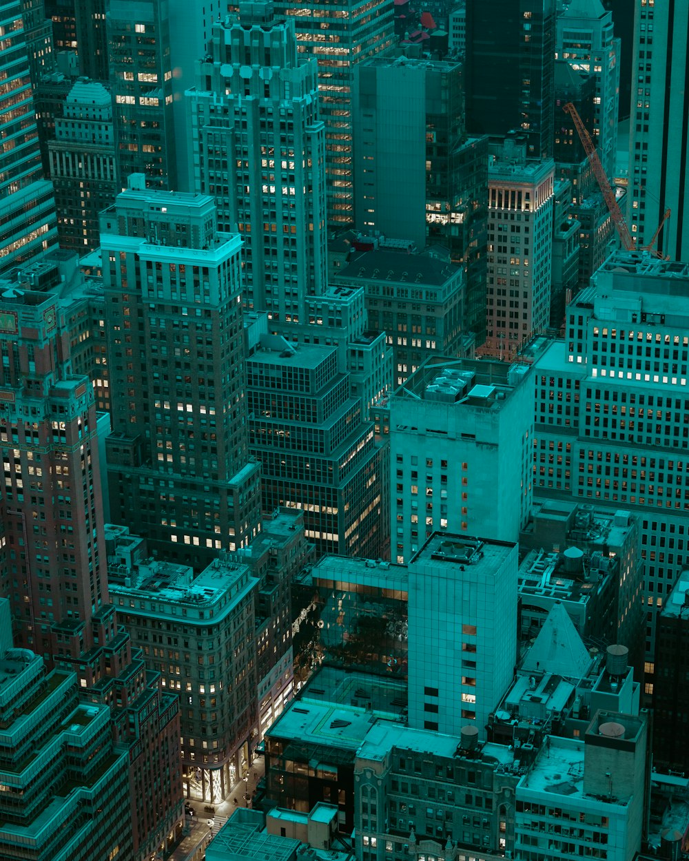 a view of a city at night from the top of a tall building