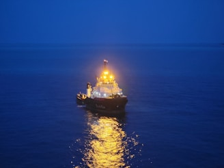 a large boat floating on top of a body of water