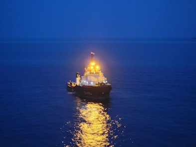a large boat floating on top of a body of water