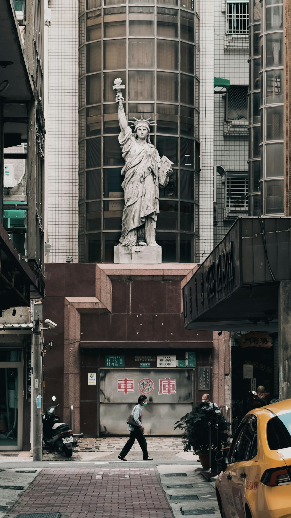 a statue of liberty in the middle of a city