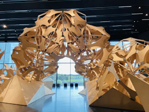 Large-scale wooden structure inspired by museum exhibit design, showcasing intricate joinery