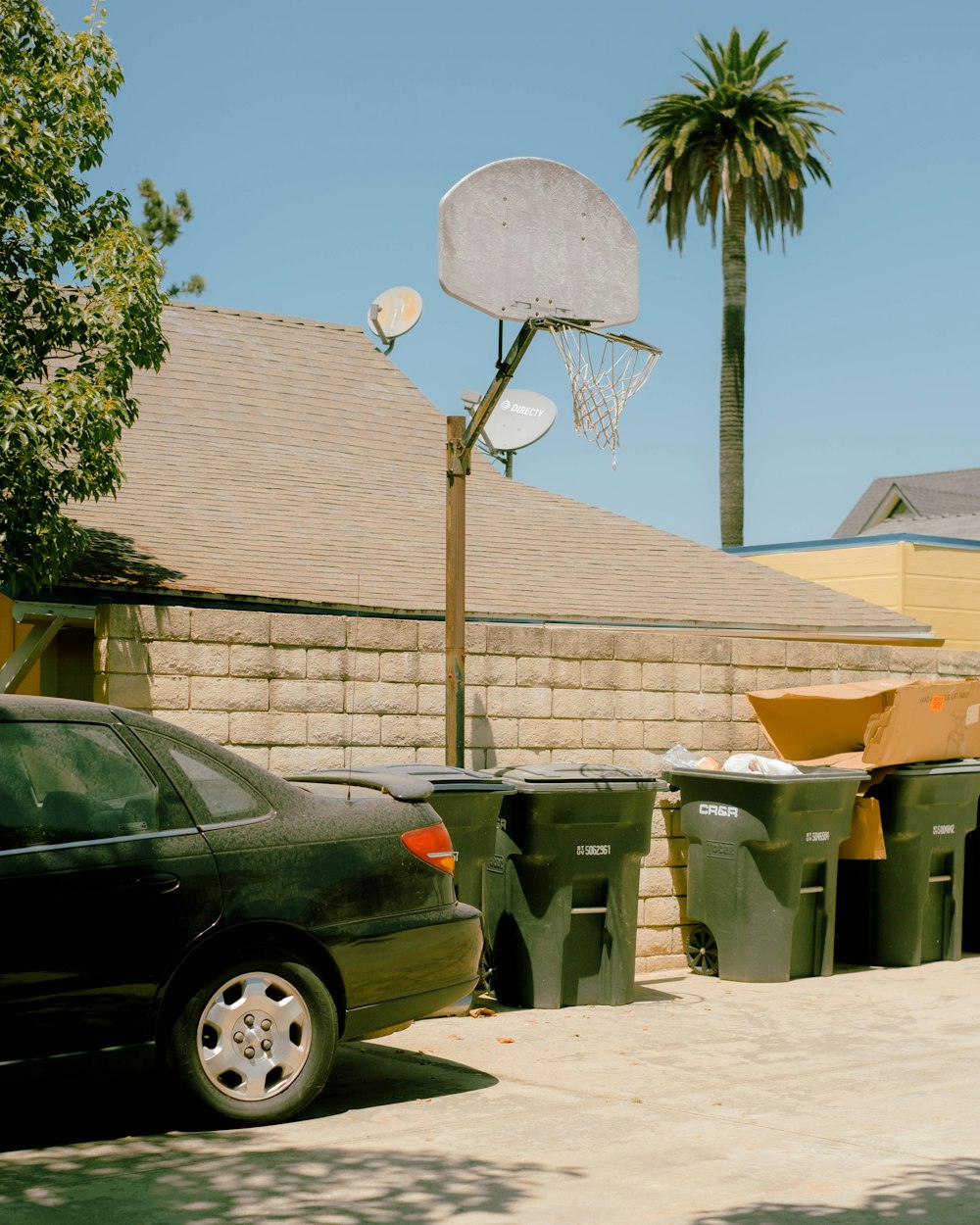 a car parked in front of a basketball hoop