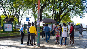 A group of active young adults wearing colorful Zrow outfits in a vibrant urban park