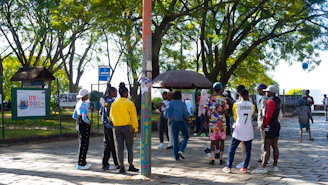 A group of active young adults wearing colorful Zrow outfits in a vibrant urban park